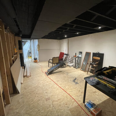 Basement renovation workout room before